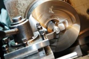 National Manual Lathe turning a precision part